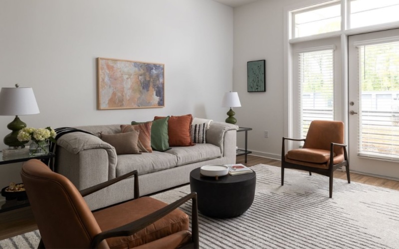 a living room with a couch and chairs