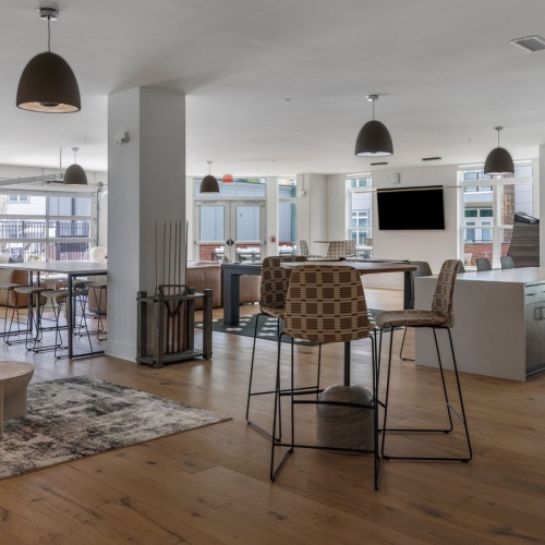 a clubroom with tables and chairs