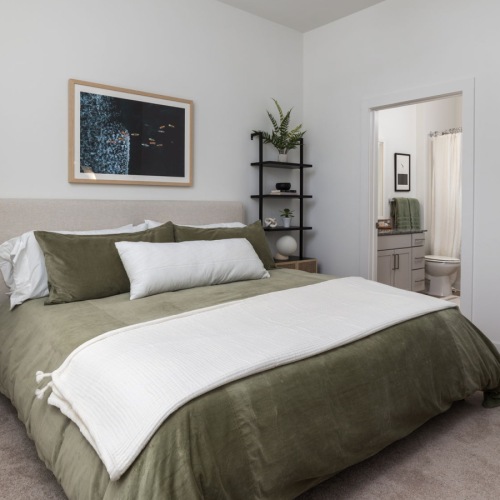 a bedroom with a bed and nightstands