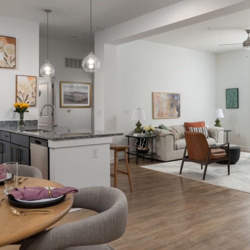 a dining room with a table and chairs