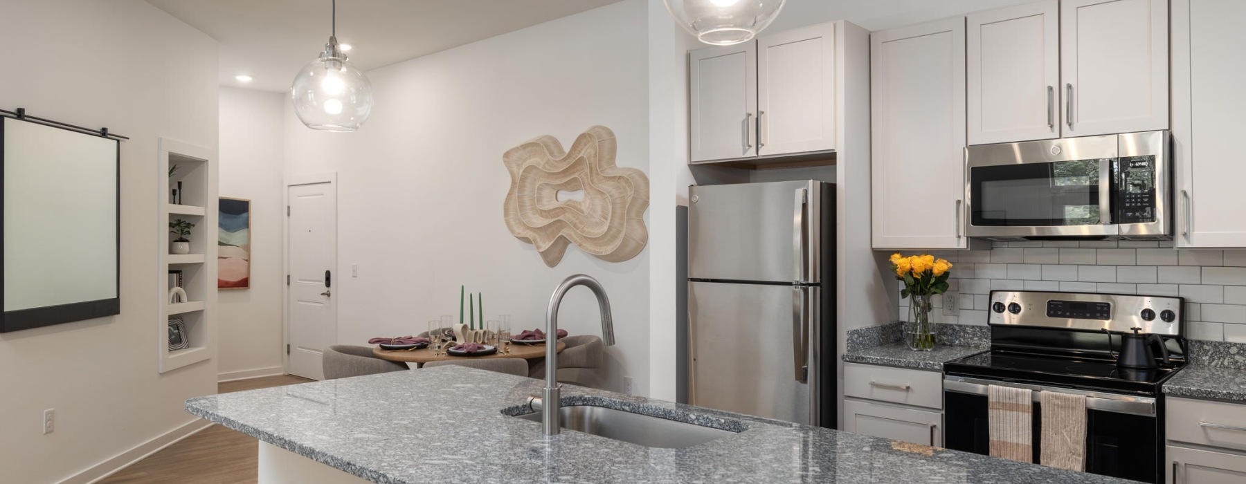 a kitchen with white cabinets
