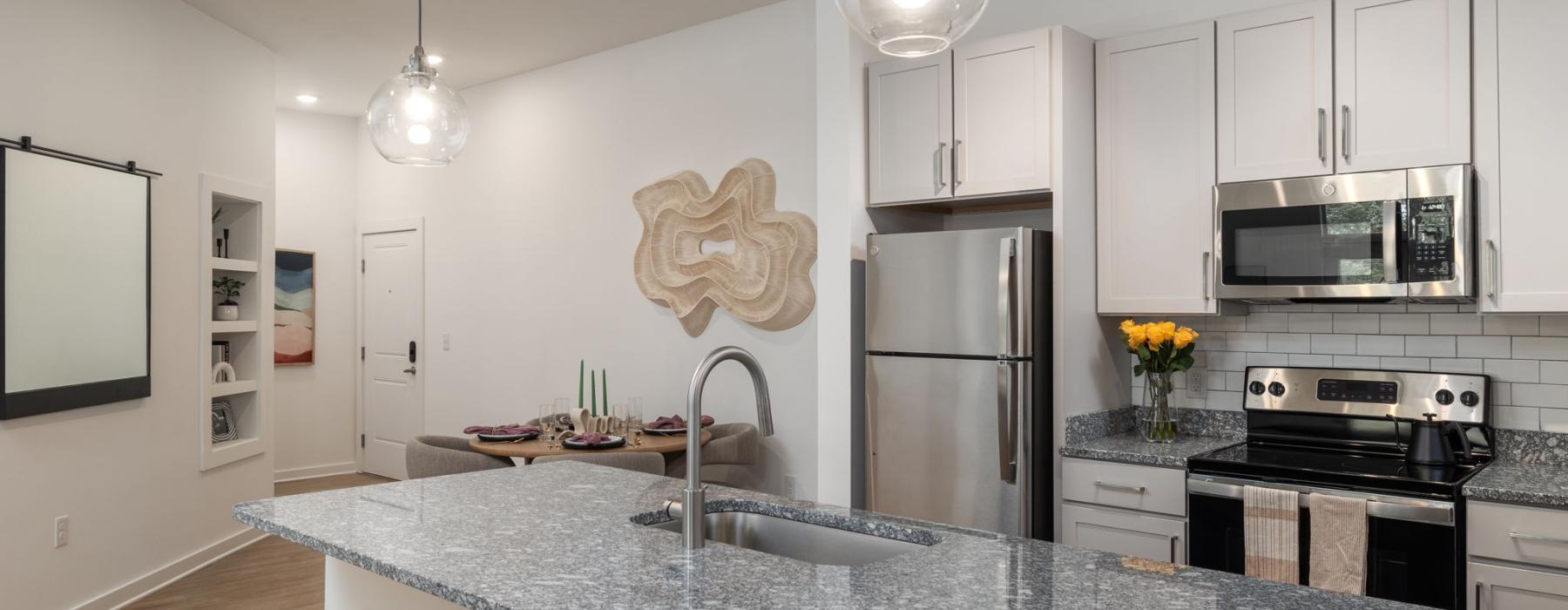 a kitchen with white cabinets